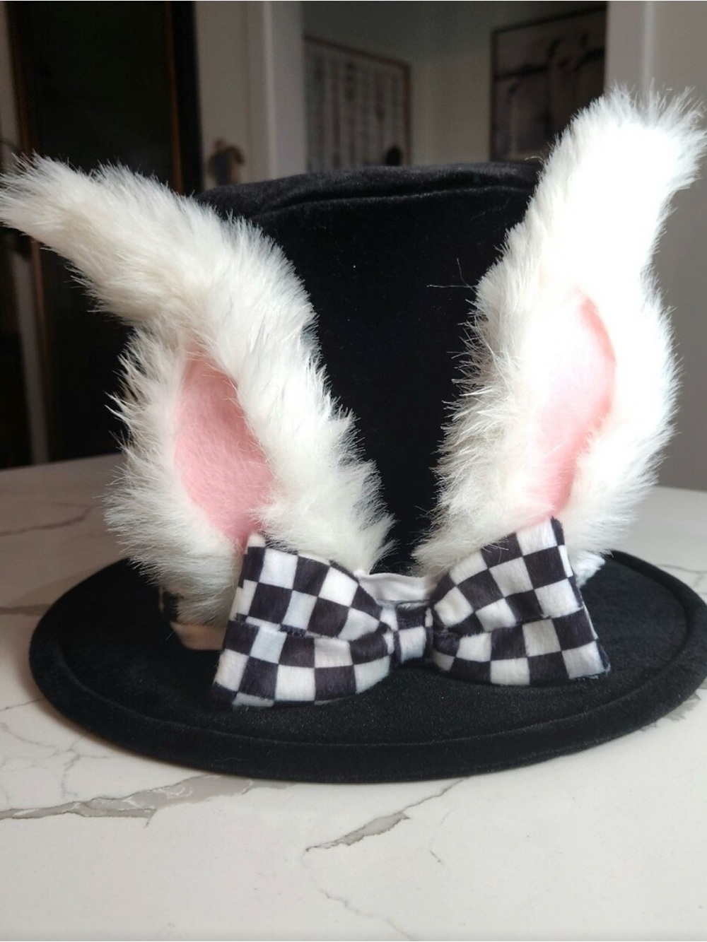 Black Top Hat with White Faux Fur Bunny Ears and Checkered Bow